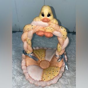 Porcelain basket with cute ducky hanging off it